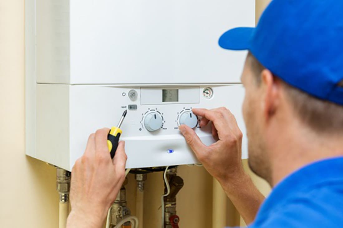 Donovan & Jorgenson Heating and Cooling technician doing boiler repair services in Milwaukee, WI