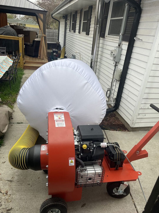 Donovan & Jorgenson Heating and Cooling Duct cleaning machine in the backyard in Mukwonago, WI