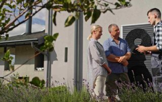 A Professional Explaining HVAC Best Practices to a Couple