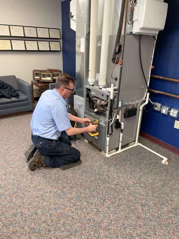 Close-up of HVAC equipment repair by Donovan & Jorgenson Heating and Cooling