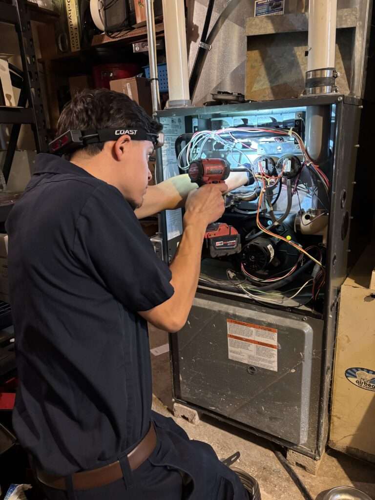 AirEase HVAC Units Installed Outside Brick Home for Heating and Cooling in Mukwonago, WI